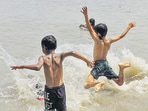 Children cool off in the Ganga river in Howrah on Sunday. (ANI) Children cool off in the Ganga river in Howrah on Sunday. (ANI)