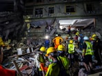 Rescuers work at the site of a damaged building, in the aftermath of a strong earthquake, in Mandalay, Myanmar, on March 30, 2025.