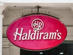 Temasek, Singapore's sovereign investment firm, is acquiring a minority 10 per cent stake in Haldiram Snacks Food -- India's largest packed snack and sweets company and restaurant operator -- at a valuation of USD 10 billion. Temasek, Singapore's sovereign investment firm, is acquiring a minority 10 per cent stake in Haldiram Snacks Food -- India's largest packed snack and sweets company and restaurant operator -- at a valuation of USD 10 billion.