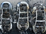 A drone view shows charred Tesla vehicles following a fire at a Tesla dealership that destroyed vehicles, in Rome.