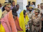 Police take away Merchant Navy officer Saurabh Rajput's wife Muskan and her lover Sahil Shukla after they were arrested in connection with his murder, 