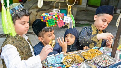 Children shop at a stall on the eve of Eid Al-Fitr festival, in Ajmer on Sunday. (ANI) Children shop at a stall on the eve of Eid Al-Fitr festival, in Ajmer on Sunday. (ANI)