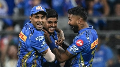 Mumbai Indians' Ashwani Kumar (C) celebrates with his captain Hardik Pandya (R) and teammate Suryakumar Yadav. (AFP) Mumbai Indians' Ashwani Kumar (C) celebrates with his captain Hardik Pandya (R) and teammate Suryakumar Yadav. (AFP)