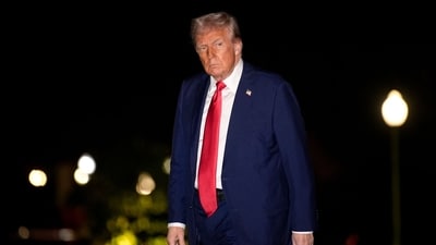 US President Donald Trump walks on the South Lawn of the White House after arriving on Marine One in Washington, DC. (Bloomberg) US President Donald Trump walks on the South Lawn of the White House after arriving on Marine One in Washington, DC. (Bloomberg)