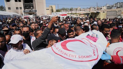 Mourners carry the bodies of 8 Red Crescent emergency responders, recovered in Rafah a week after an Israeli attack. (AP)