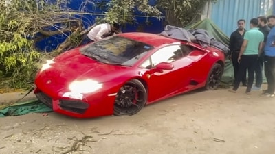 People gather around a Lamborghini car after it allegedly hit people in Noida on Sunday. (PTI) People gather around a Lamborghini car after it allegedly hit people in Noida on Sunday. (PTI)