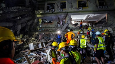 Rescuers work at the site of a damaged building, in the aftermath of a strong earthquake, in Mandalay, Myanmar, on March 30, 2025. (File/REUTERS)