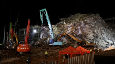 Heavy machinery stand at the site of a building that collapsed, following a strong earthquake, in Bangkok. (Reuters)