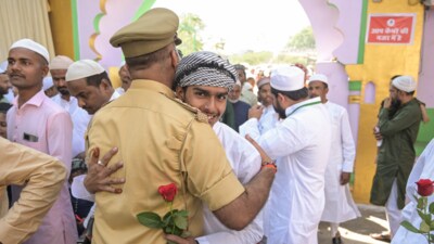 A police officer hugs to greet a person after namaz during the Eid-Ul-Fitr festival celebrations, at Eidgah in Prayagraj, Monday, March 31, 2025. (PTI) A police officer hugs to greet a person after namaz during the Eid-Ul-Fitr festival celebrations, at Eidgah in Prayagraj, Monday, March 31, 2025. (PTI)