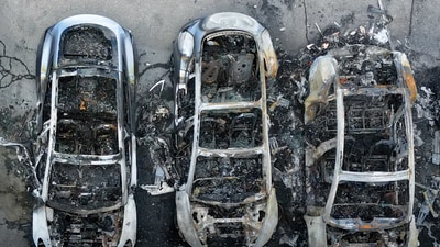 A drone view shows charred Tesla vehicles following a fire at a Tesla dealership that destroyed vehicles, in Rome. (REUTERS)