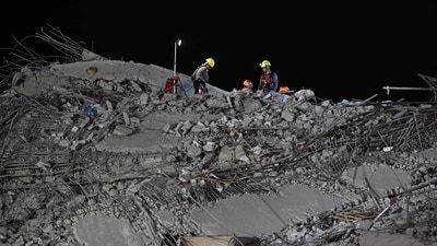 Rescue workers clear rubble on the top at the site of an under-construction building collapse in Bangkok on March 30, 2025. (AFP) Rescue workers clear rubble on the top at the site of an under-construction building collapse in Bangkok on March 30, 2025. (AFP)