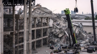 The Chinese men were reportedly caught removing 32 files from a building in Bangkok that collapsed during the Myanmar earthquake. (AFP)