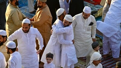 Devotees exchange greetings after Eid prayers at Delhi's Jama Masjid on Monday. Many were seen helping police personnel manage the crowd after the prayers and ensuring that people exited the mosque in an orderly manner. (Raj K Raj/HT) Devotees exchange greetings after Eid prayers at Delhi's Jama Masjid on Monday. Many were seen helping police personnel manage the crowd after the prayers and ensuring that people exited the mosque in an orderly manner. (Raj K Raj/HT)