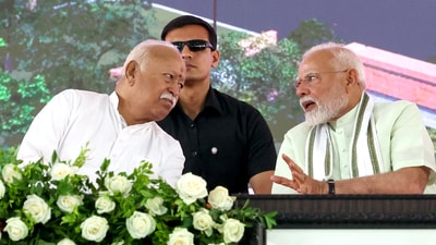 Prime Minister Narendra Modi in a conversation with Rashtriya Swayamsevak Sangh (RSS) Chief Mohan Bhagwat during the foundation stone laying for Madhav Netralaya Premium Centre, in Nagpur on Sunday. (DPR PMO) Prime Minister Narendra Modi in a conversation with Rashtriya Swayamsevak Sangh (RSS) Chief Mohan Bhagwat during the foundation stone laying for Madhav Netralaya Premium Centre, in Nagpur on Sunday. (DPR PMO)