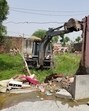 In a joint drive, the Kapurthala civil and police administration demolished three illegal structures owned by drug smugglers in Boot village of the district on Tuesday. (HT Photo)