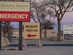 SEMINOLE, TEXAS - FEBRUARY 27: Signs point the way to measles testing in the parking lot of the Seminole Hospital District across from Wigwam Stadium on February 27, 2025 in Seminole, Texas. (Photo by Jan Sonnenmair / GETTY IMAGES NORTH AMERICA / Getty Images via AFP)