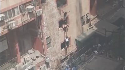 A screengrab from CCTV footage shows people jumping out of the windows in Noida Sector 18. (HT Photo) A screengrab from CCTV footage shows people jumping out of the windows in Noida Sector 18. (HT Photo)