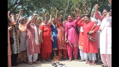 Anganwadi workers holding a protest in Ludhiana on Tuesday. (Gurpreet Singh/HT)