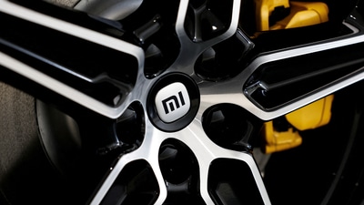 The logo of Xiaomi is seen on a tyre wheel of Xiaomi's first electric vehicle SU7, which is displayed at a showroom of a newly opened Xiaomi store in Beijing, China March 25, 2024. (Tingshu Wang/Reuters)
