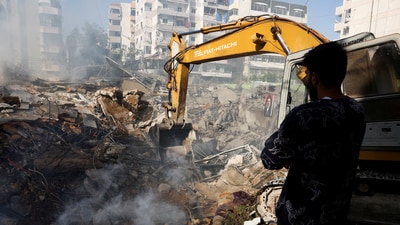 A man watches at the site of an Israeli strike, in Beirut southern suburbs, Lebanon. (Reuters)