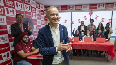 Liberal Leader Mark Carney applauds supporters at his campaign office in Nepean, on March 29. (AP) Liberal Leader Mark Carney applauds supporters at his campaign office in Nepean, on March 29. (AP)