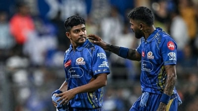 Mumbai Indians' captain Hardik Pandya with Ashwani Kumar. (AFP)