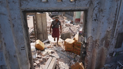According to the World Health Organisation, there have been reports of 22 hospitals in the area being partially damaged and three hospitals being completely destroyed. In pic: A man walks through a damaged building following Friday's earthquake in Naypyitaw, Myanmar. (AP) According to the World Health Organisation, there have been reports of 22 hospitals in the area being partially damaged and three hospitals being completely destroyed. In pic: A man walks through a damaged building following Friday's earthquake in Naypyitaw, Myanmar. (AP)