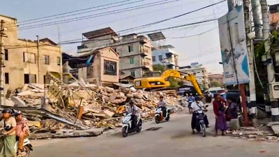 Mandalay: Commuters pass by the debris of damaged buildings in the aftermath of earthquake. (PTI) Mandalay: Commuters pass by the debris of damaged buildings in the aftermath of earthquake. (PTI)