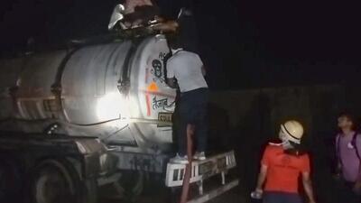 Rescuers check the nitrogen gas leak from a tanker parked inside an acid factory in Rajasthan's Beawar (PTI) Rescuers check the nitrogen gas leak from a tanker parked inside an acid factory in Rajasthan's Beawar (PTI)