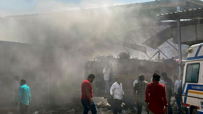 People gather at the site after a blast at a firecracker warehouse led to a blaze and collapse of the building, in Gujarat's Banaskantha district on April 1, 2025. (PTI) People gather at the site after a blast at a firecracker warehouse led to a blaze and collapse of the building, in Gujarat's Banaskantha district on April 1, 2025. (PTI)