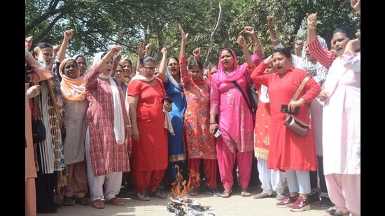 Anganwadi workers holding a protest in Ludhiana on Tuesday. (Gurpreet Singh/HT)