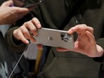 A man checks an iPhone 16 Pro Max as the new iPhone 16 series smartphones go on sale at an Apple store in Beijing, China September 20, 2024. REUTERS//File Photo