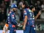 Lucknow Super Giants' Digvesh Rathi (C) celebrates with captain Rishabh Pant (L) after taking the wicket of Punjab Kings' Prabhsimran Singh