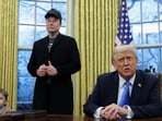 US President Donald Trump speaks next to Elon Musk in the Oval Office of the White House in Washington.