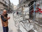 A man stands outside a closed-down bakery that ran out of flour in Gaza City on April 1, 2025. A man stands outside a closed-down bakery that ran out of flour in Gaza City on April 1, 2025.