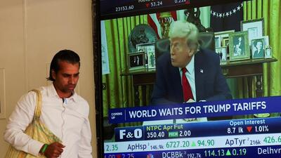 A man walks past a screen displaying U.S. President Donald Trump, at the Bombay Stock Exchange (BSE) ahead of Trump's tariff plans, in Mumbai. (REUTERS) A man walks past a screen displaying U.S. President Donald Trump, at the Bombay Stock Exchange (BSE) ahead of Trump's tariff plans, in Mumbai. (REUTERS)