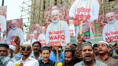 People hold placards expressing gratitude to Prime Minister Narendra Modi for introducing the Waqf Amendment Bill in Parliament, in Bhopal on Wednesday. (ANI) People hold placards expressing gratitude to Prime Minister Narendra Modi for introducing the Waqf Amendment Bill in Parliament, in Bhopal on Wednesday. (ANI)