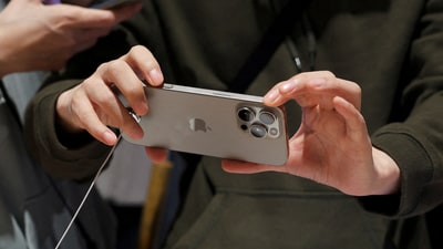 A man checks an iPhone 16 Pro Max as the new iPhone 16 series smartphones go on sale at an Apple store in Beijing, China September 20, 2024. REUTERS//File Photo (Florence Lo/Reuters)