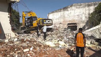 Debris being removed after a massive blaze triggered by a blast raged through a firecracker warehouse in Banaskantha district, Gujarat, on Tuesday. (PTI) Debris being removed after a massive blaze triggered by a blast raged through a firecracker warehouse in Banaskantha district, Gujarat, on Tuesday. (PTI)