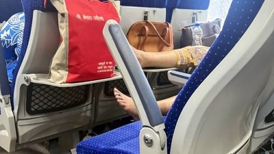 A post on X went viral after a woman was seen lying with her bare feet on the armrest of a train. (X/@Ravi3pathi) A post on X went viral after a woman was seen lying with her bare feet on the armrest of a train. (X/@Ravi3pathi)