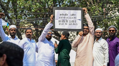 Muslims hold a placard while protesting against the Waqf Amendment Bill after offering namaz on Eid-ul-Fitr, in Ranchi, Monday, March 31, 2025. (PTI) Muslims hold a placard while protesting against the Waqf Amendment Bill after offering namaz on Eid-ul-Fitr, in Ranchi, Monday, March 31, 2025. (PTI)
