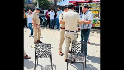 Police investigating the shooting outside the Karnal court on Wednesday. (HT Photo)
