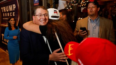 Randy Fine, Republican nominee for 2025 Florida's 6th congressional district special election, meets his supporter as he celebrates his win, at a watch party, as Florida. (REUTERS)