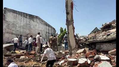 Rescue operations after a portion of a firecracker godown collapsed following an explosion in the Deesa area in Banaskantha on Tuesday. (ANI) Rescue operations after a portion of a firecracker godown collapsed following an explosion in the Deesa area in Banaskantha on Tuesday. (ANI)