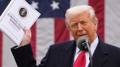 Trump waved the Foreign Trade Barriers 2025 report during his tariff speech (AP) Trump waved the Foreign Trade Barriers 2025 report during his tariff speech (AP)