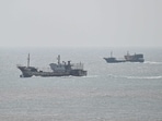 Greece's coast guard reported Thursday that 23 people had been rescued when a boat carrying migrants from the Turkish shore to a nearby Greek island capsized, killing four people, including two children.