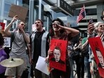 Demonstrators rally against Tesla CEO Elon Musk during a "Tesla Takedown" protest outside a Tesla Store in New York on March 29, 2025.