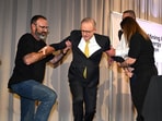 Australian Prime Minister Anthony Albanese is assisted after falling off a stage on Day 6 of the 2025 federal election campaign, in the Hunter Valley, Australia, 