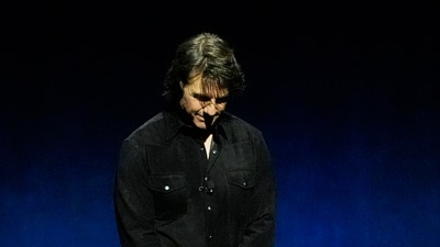 Tom Cruise, star of the upcoming film "Mission: Impossible - The Final Reckoning," leads a moment of silence for late actor Val Kilmer during the Paramount Pictures presentation at CinemaCon at Caesars Palace on Thursday, April 3, 2025, in Las Vegas. (AP Photo/Chris Pizzello) (Chris Pizzello/Invision/AP) Tom Cruise, star of the upcoming film "Mission: Impossible - The Final Reckoning," leads a moment of silence for late actor Val Kilmer during the Paramount Pictures presentation at CinemaCon at Caesars Palace on Thursday, April 3, 2025, in Las Vegas. (AP Photo/Chris Pizzello) (Chris Pizzello/Invision/AP)