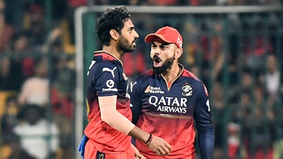 Royal Challengers Bengaluru's Virat Kohli and Bhuvneshwar Kumar celebrate the wicket of Gujarat Titans' captain Shubman Gill (Surjeet Yadav) Royal Challengers Bengaluru's Virat Kohli and Bhuvneshwar Kumar celebrate the wicket of Gujarat Titans' captain Shubman Gill (Surjeet Yadav)